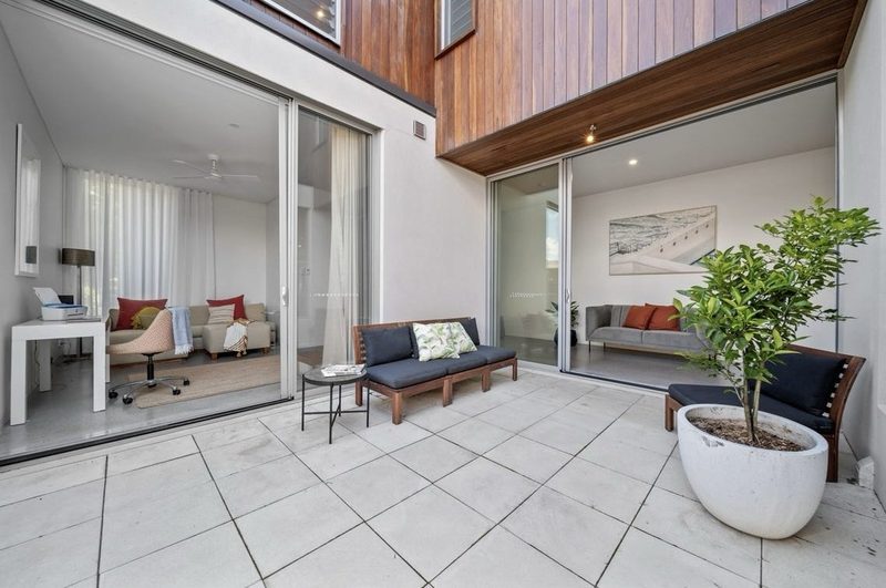 An airy courtyard links the study, hall and living areas to the outside — a shady summer retreat