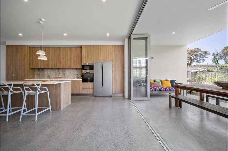 Kitchen connects to formal and informal dining areas