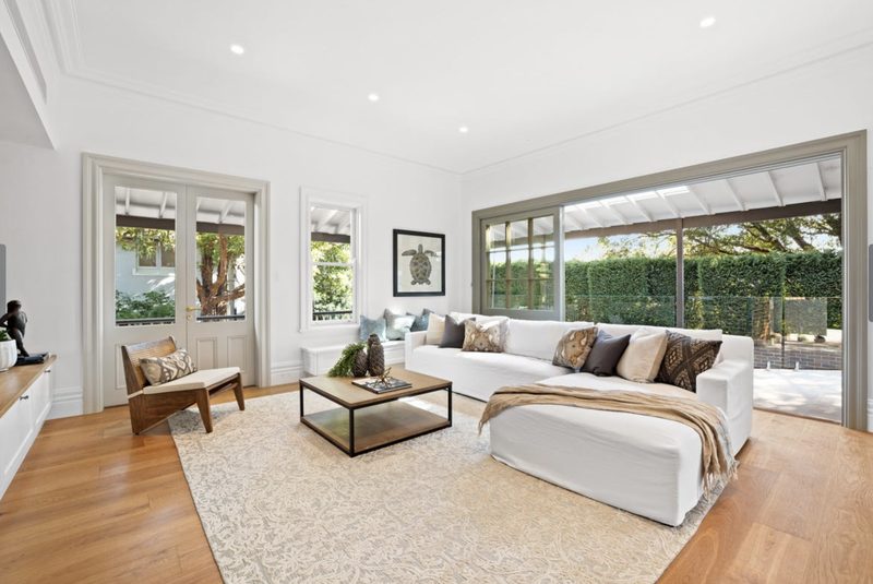 An expansive family living space now opens up onto the pool. Relocating the kitchen from the rear wall gives the building the space it needed to connect to the garden