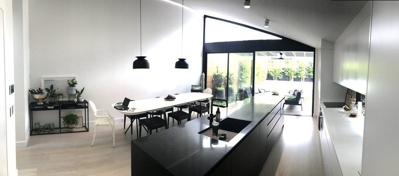 Open-plan kitchen and dining under a raised ceiling in a terrace, Summer Hill