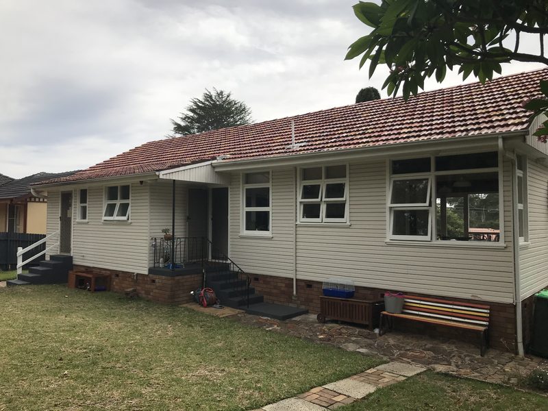 Before: the side of the original weatherboard house