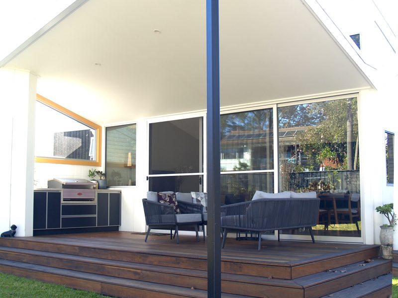 Outdoor living under the new roof, with a built-in barbecue